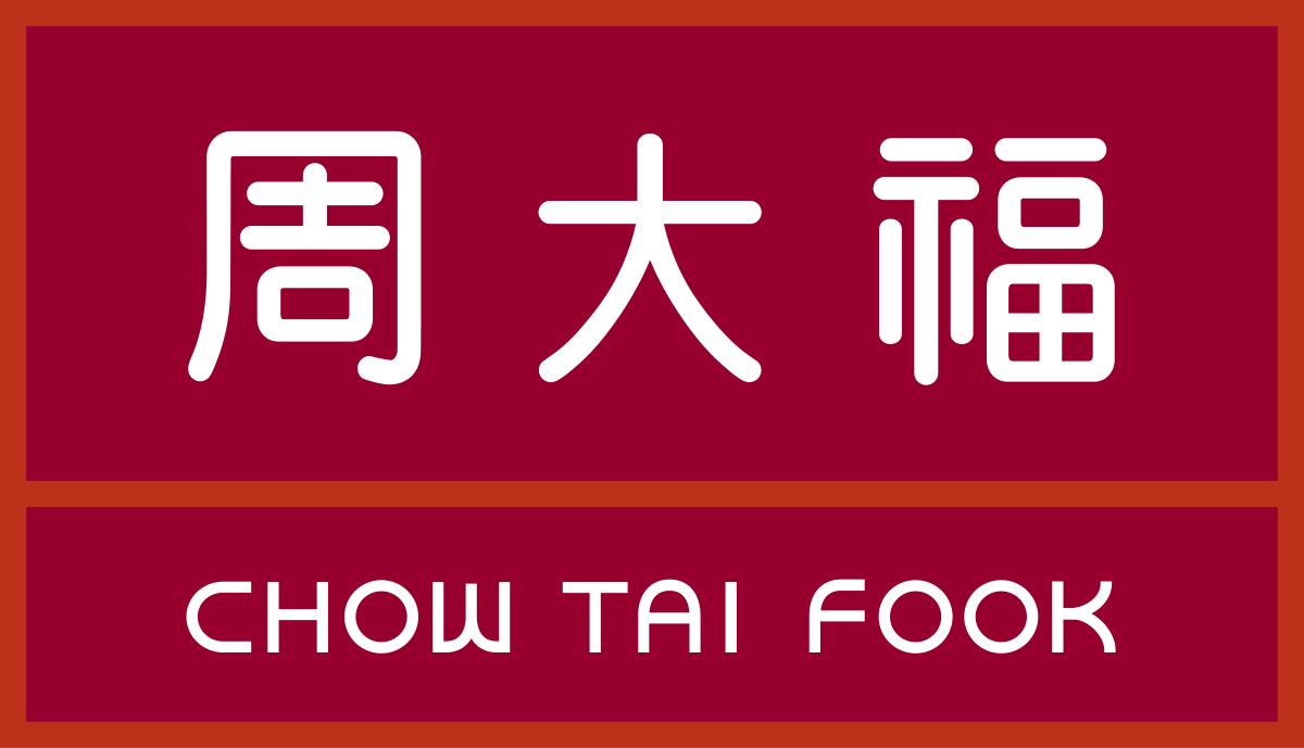 A red rectangular sign with white Chinese characters above the text "CHOW TAI FOOK" in capital letters.