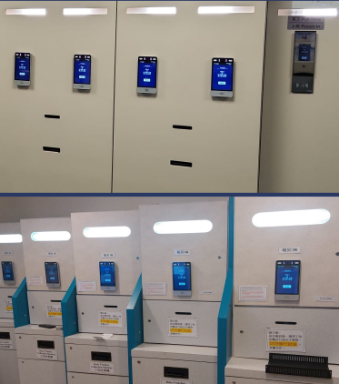 Two rows of self-service kiosks with digital screens and labeled slots, installed against a wall in an indoor setting.